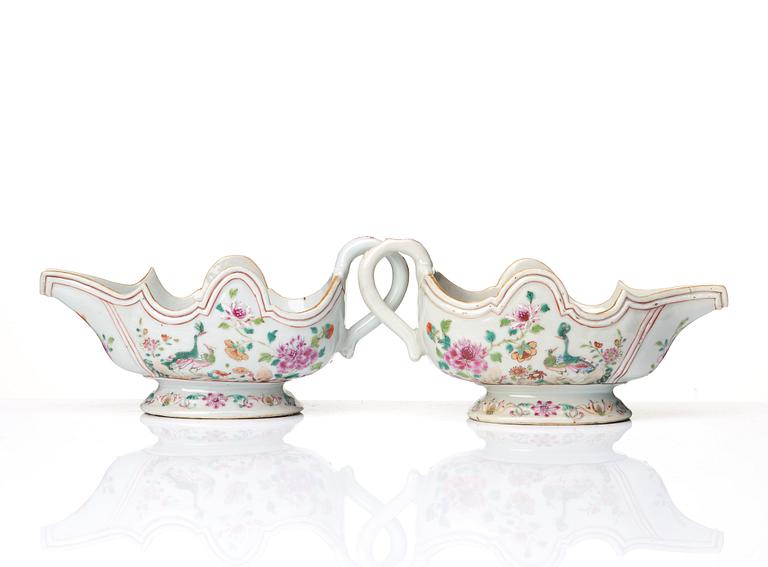 A pair of famille rose 'double peacock sauce boats, Qing dynasty, Qianlong (1736-95).