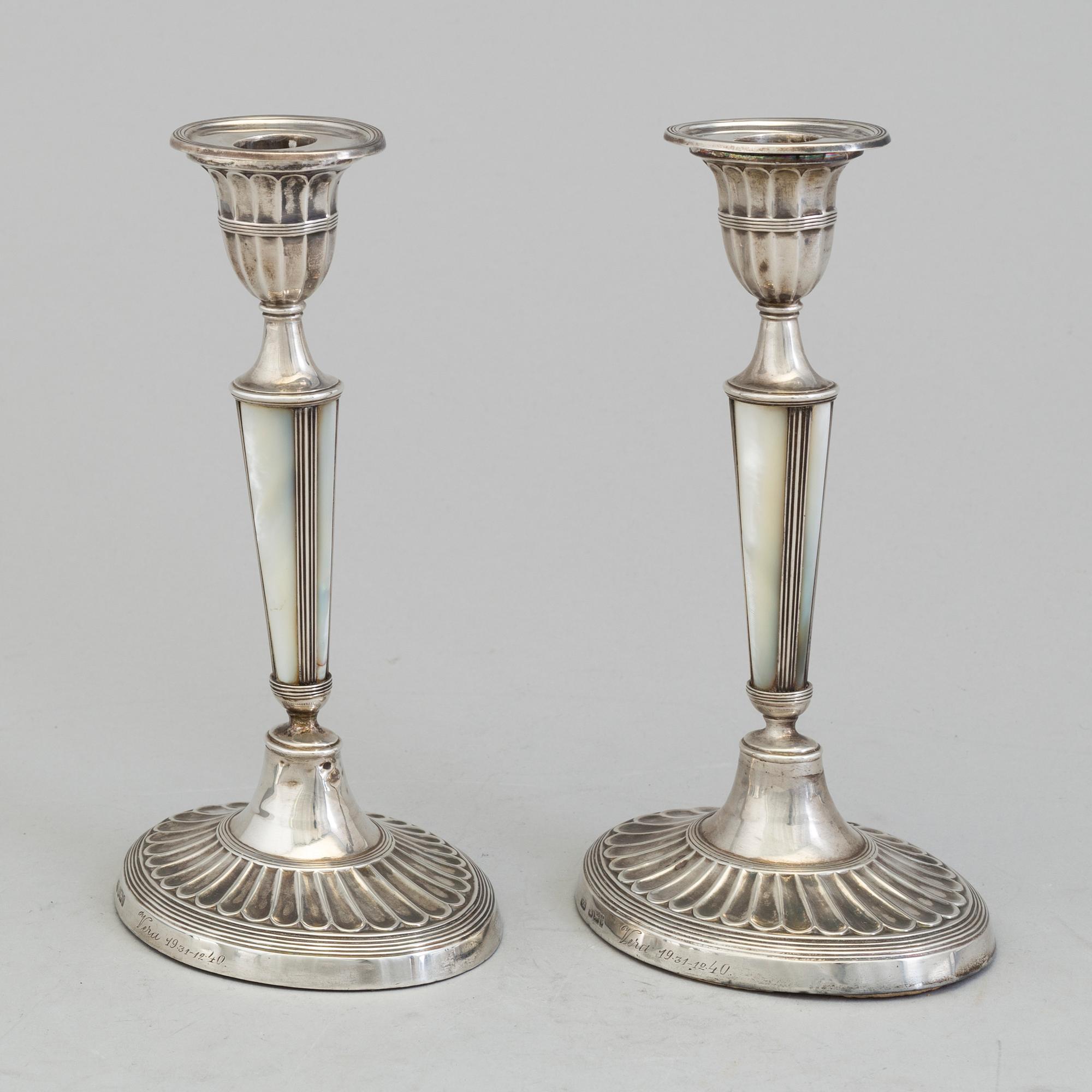 HARRISON BROTHERS & HOWSON, a pair of silver and mother of pearl candlesticks from Sheffield, England, 1926.