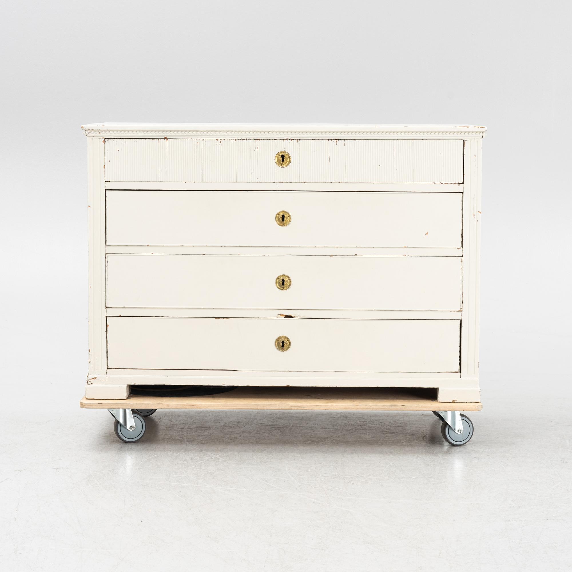 A painted chest of drawers, 19th Century.