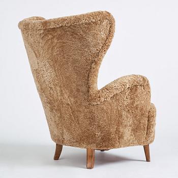 Otto Schulz, a Swedish Modern sheepskin upholstered armchair, Boet Gothenburg 1940s.