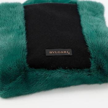 BVLGARI, a green mink stole.