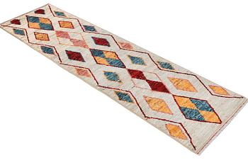 A Moroccan runner carpet, c. 297 x 81 cm.