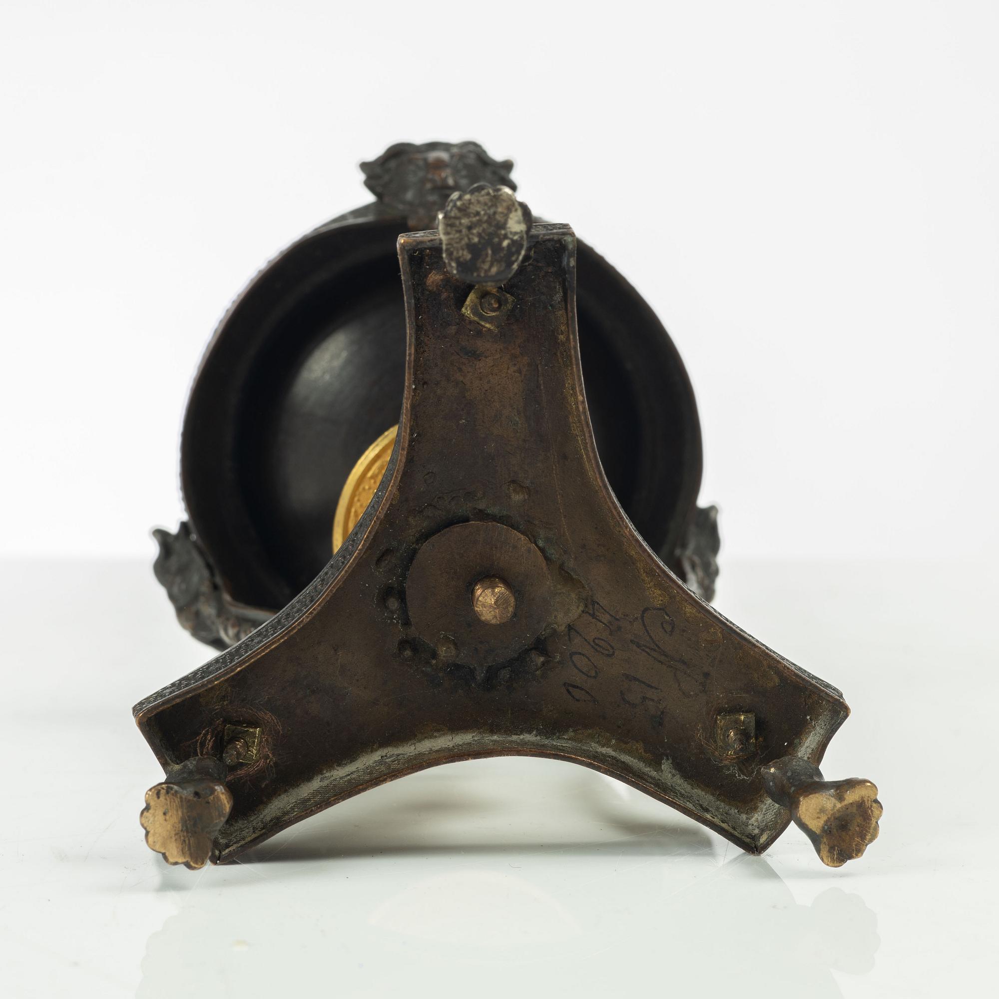 A French Empire ormolu and patinated brûle-parfume, early 19th century.