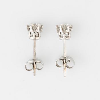 Brilliant cut diamond stud earrings.
