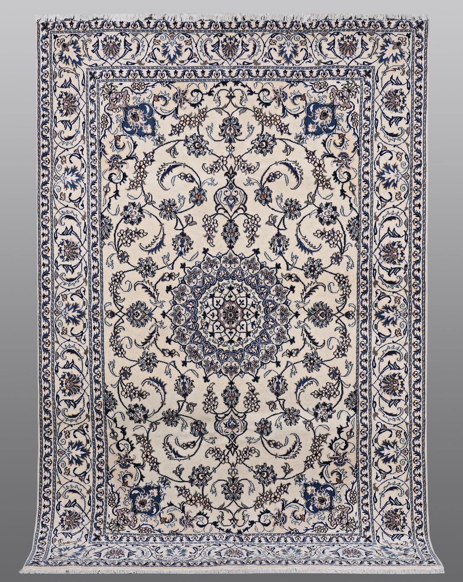 A carpet Nain, part silk, ca 290 x 196 cm.