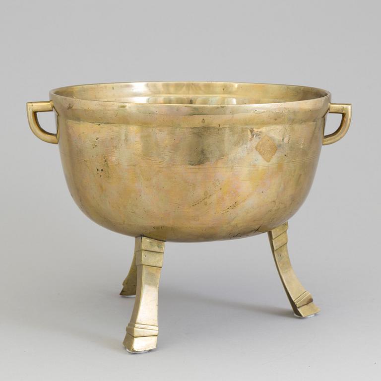 A 19th century brass stew.