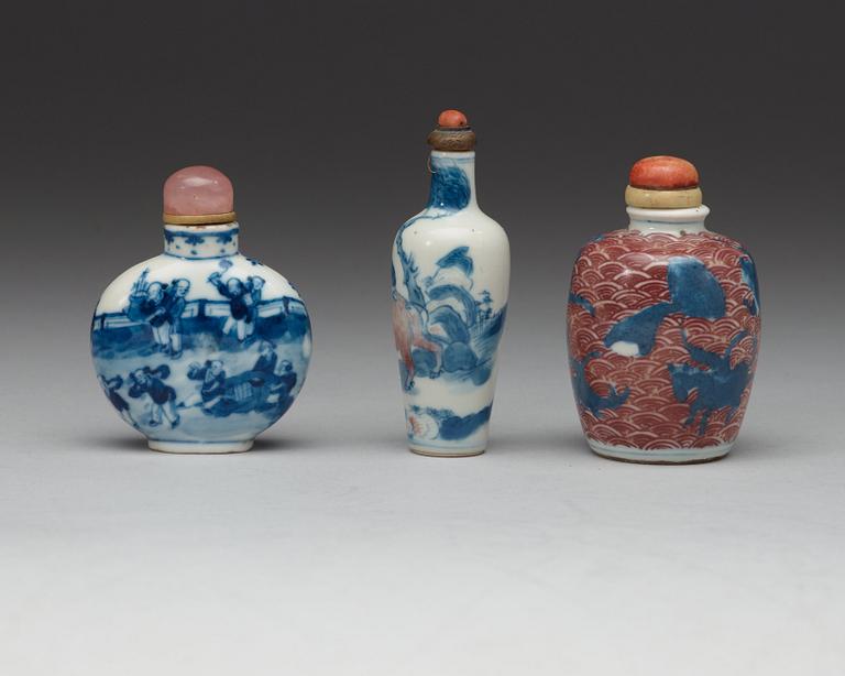 A set of three snuff bottles with stoppers, China, 20th Century.