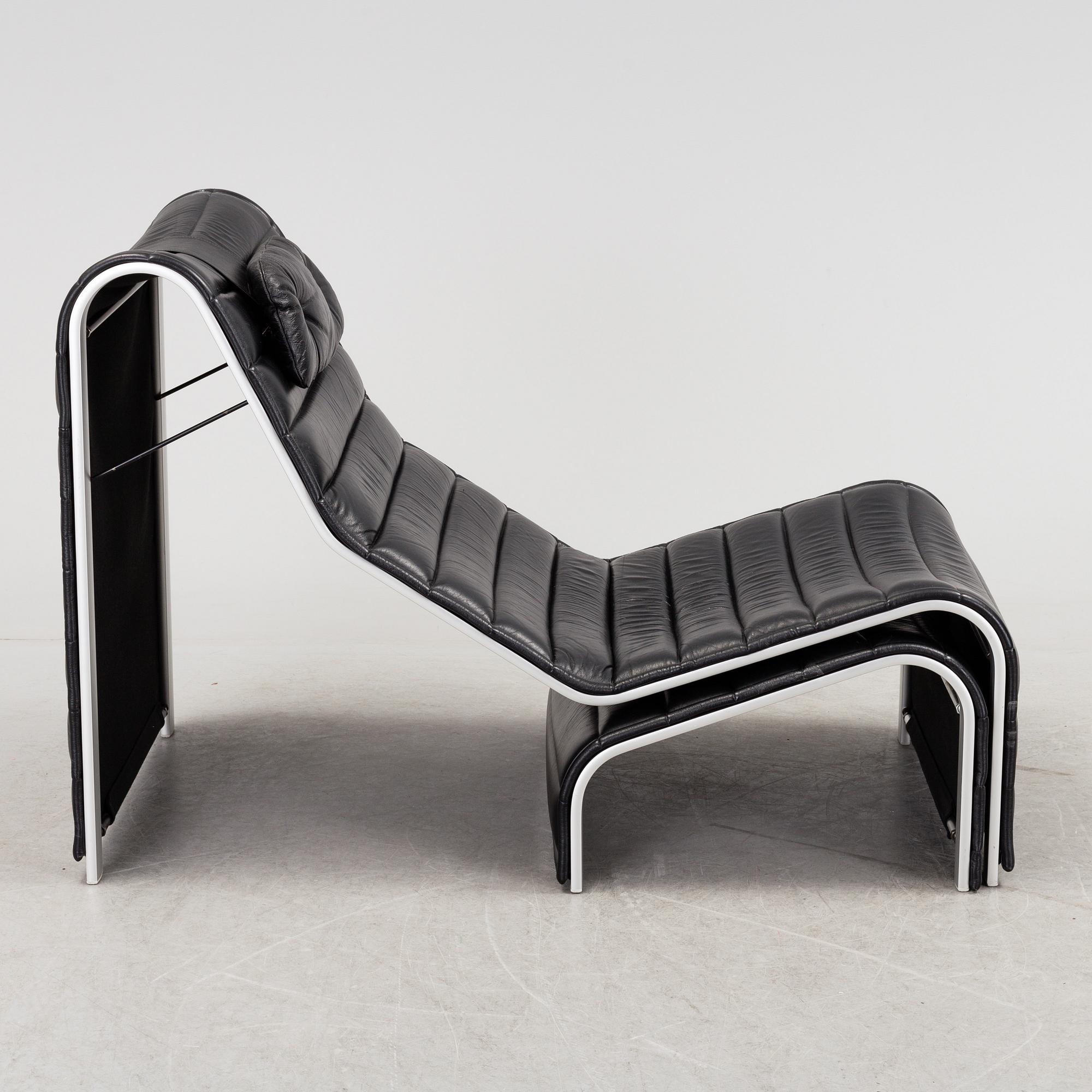 ERIC SIGFRID PERSSON, a leather upholstered lounge chair and foot stool from Möbelkultur AB.