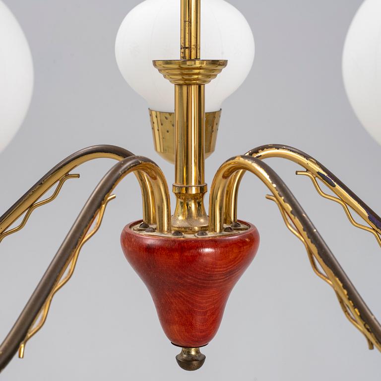 A 1950's glass and brass ceiling light.