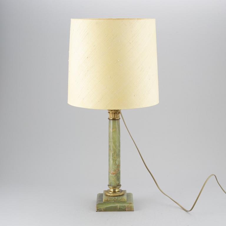 A 20th century empire style table lamp.