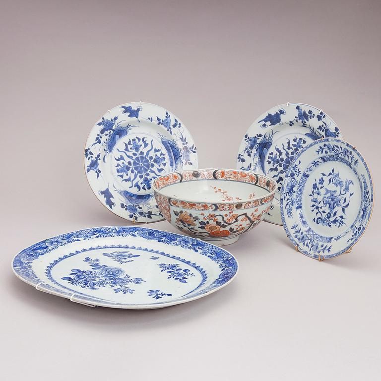 Four Chinese porcelain dishes and a Japanese porcelain bowl, 18th Century.