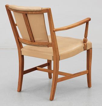 A Josef Frank valnut armchair by Svenskt Tenn.