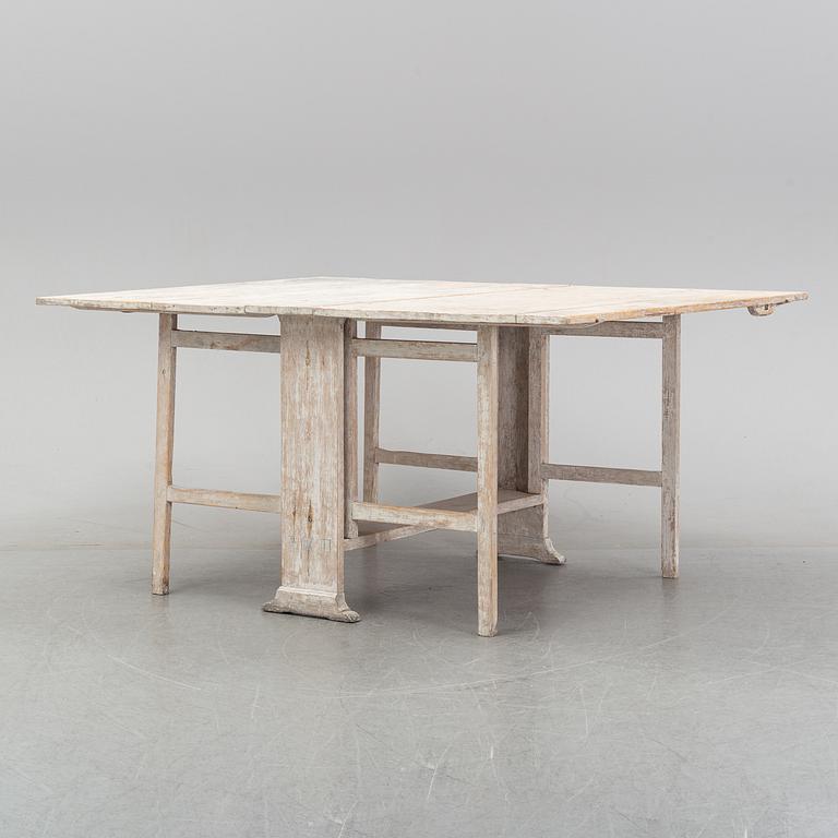 A painted gustavian gate-leg table, around the year 1800.