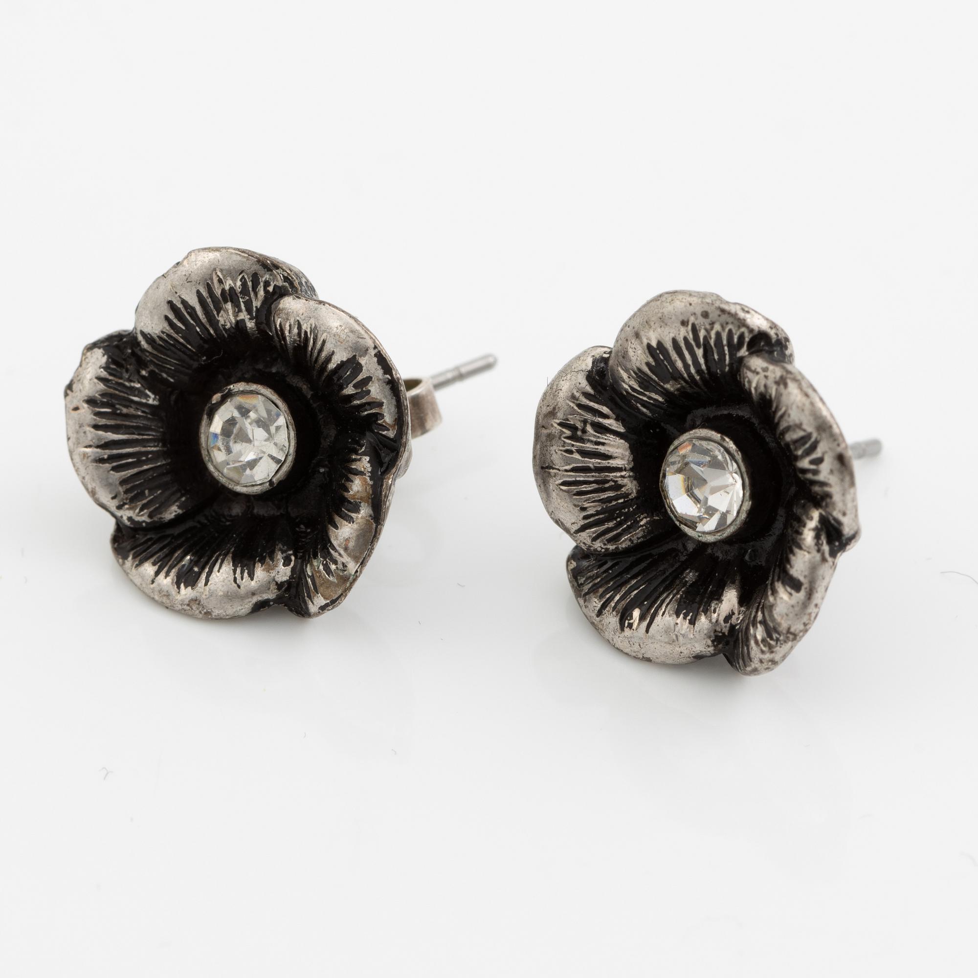 Necklace with matching earrings, white metal in floral design with glass stones.