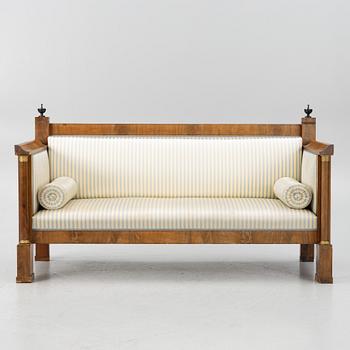 An Empire sofa, first half of the 19th century.
