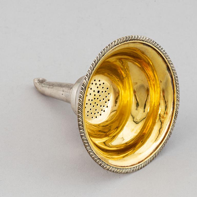 A Swedish 19th century parcel-gilt silver wine-strainer, mark of Adolf Zethelius, Stockholm 1839.