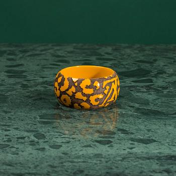 A bracelet "Leomonogram" by Louis Vuitton.