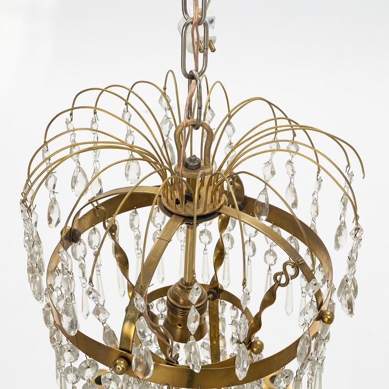 A Gustavian style 9 candle chandelier.