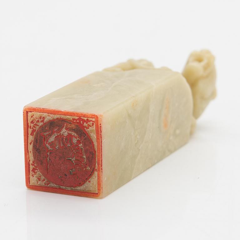 A Chinese seal, green stone, 20th century.