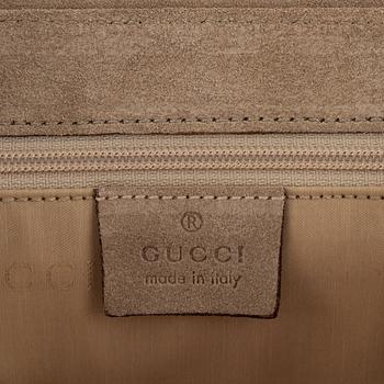 Gucci, a suede handbag.