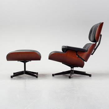 A 'Lounge chair' with stool, Charles and Ray Eames, for Vitra, 2010's.