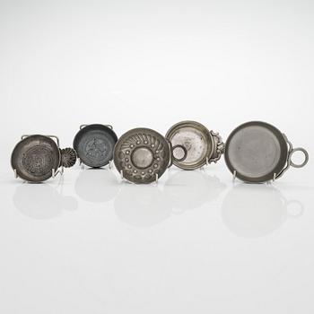 A set of fourteen tastevin cups, pewter and glass, 20th century.