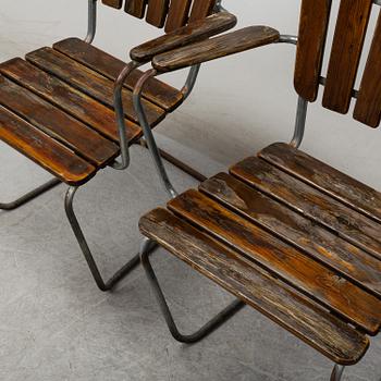 Four tubular steel and pine garden chairs, mid 20th Century.