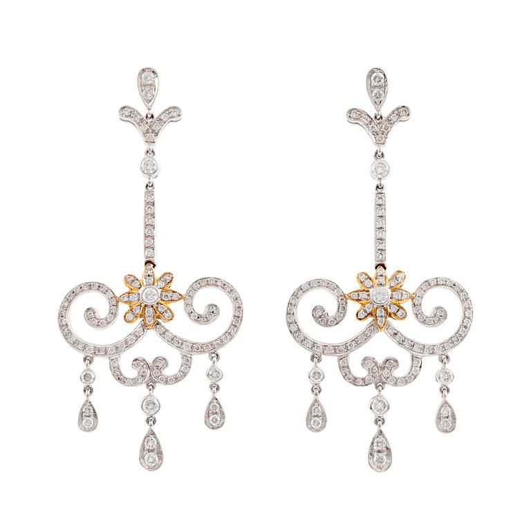 A pair of 18K white gold and round brilliant cut diamond chandelier earrings.