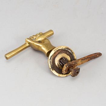 A 19th century brass door handle.