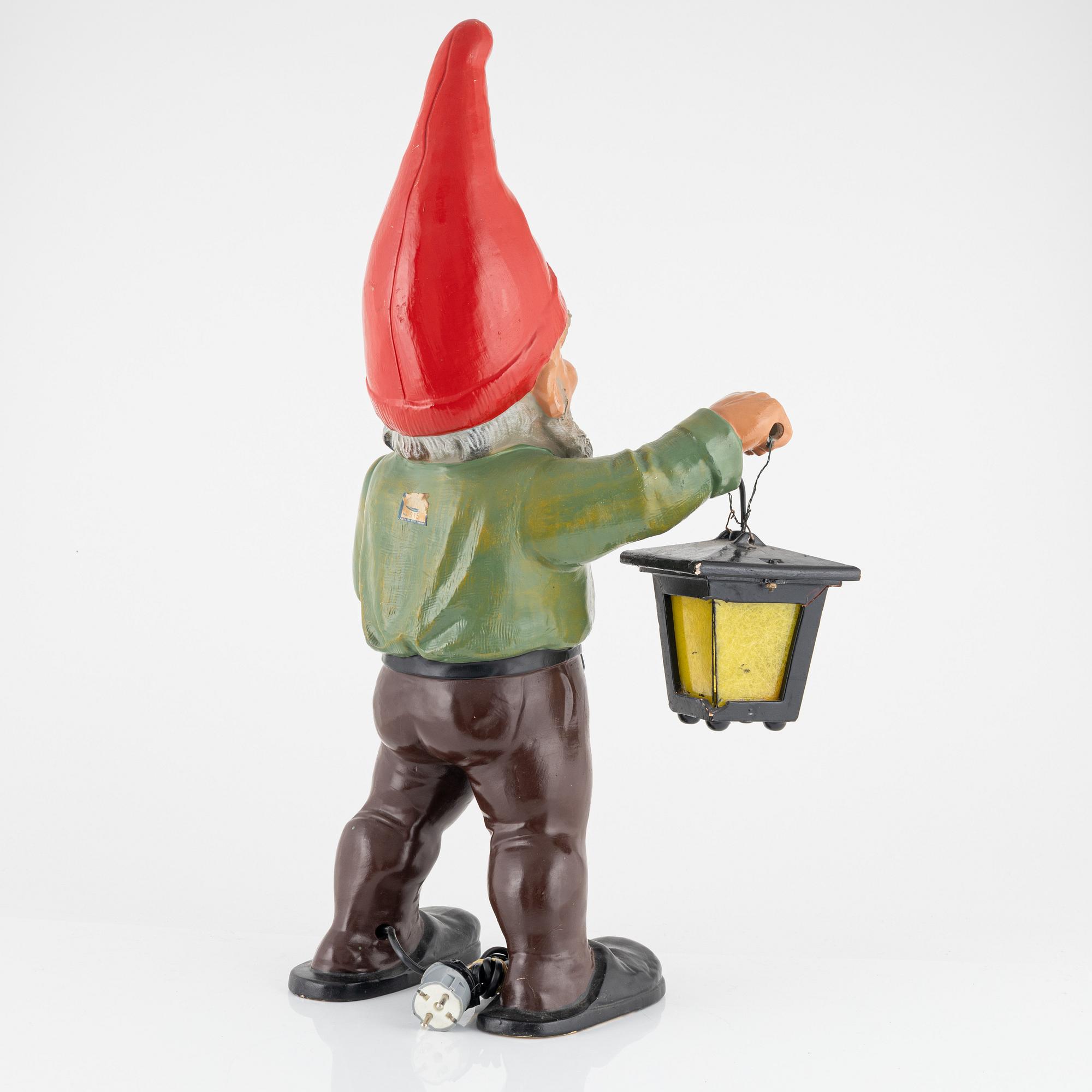 A West German earthenware gnome figurine with lantern from the second half of the 20th century.