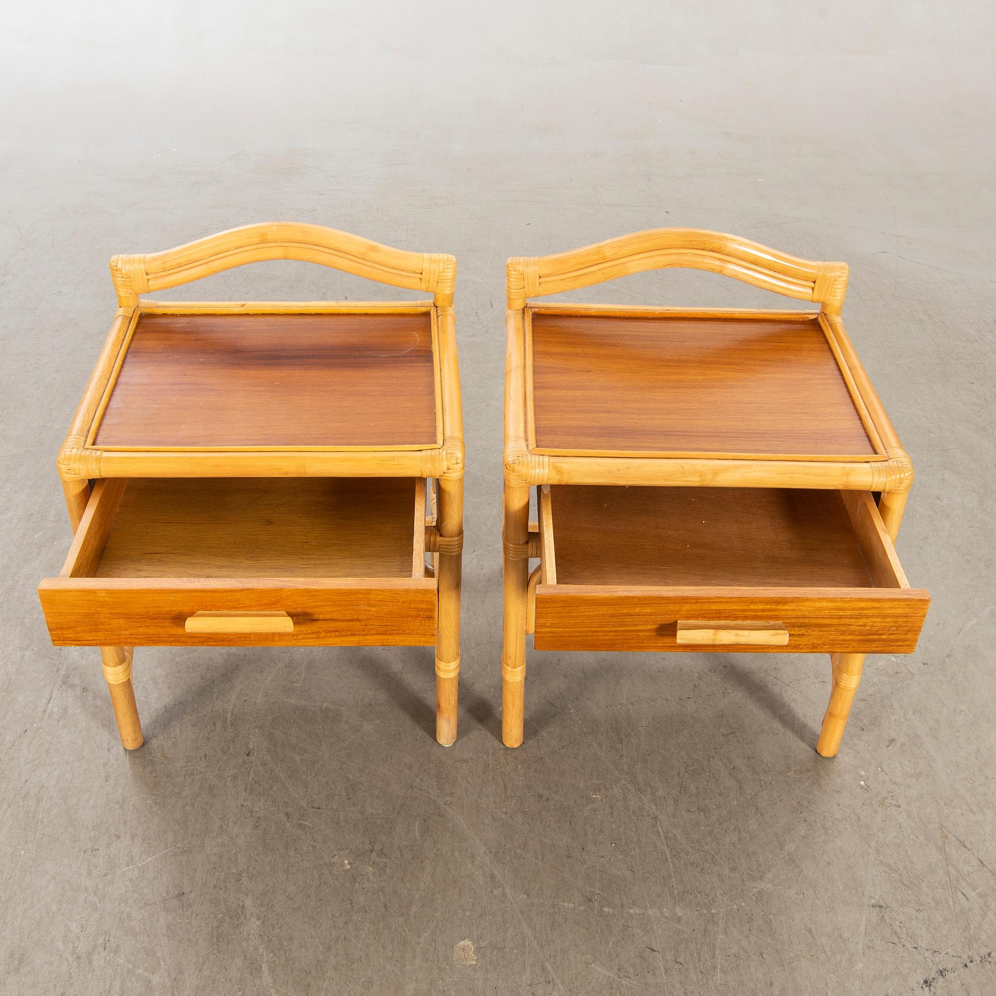 A pair of 1980s Dux rattan bedside tables.