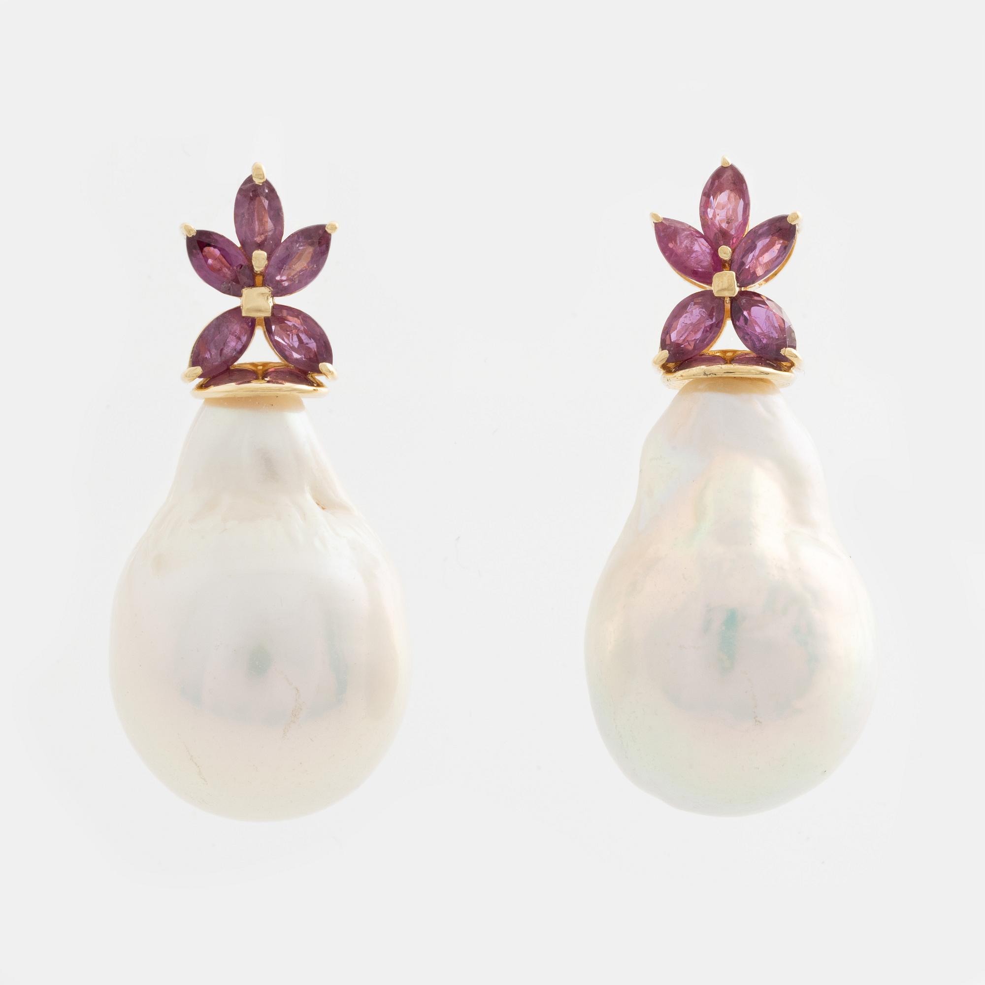 Earrings with cultured baroque freshwater pearls and pink sapphires.