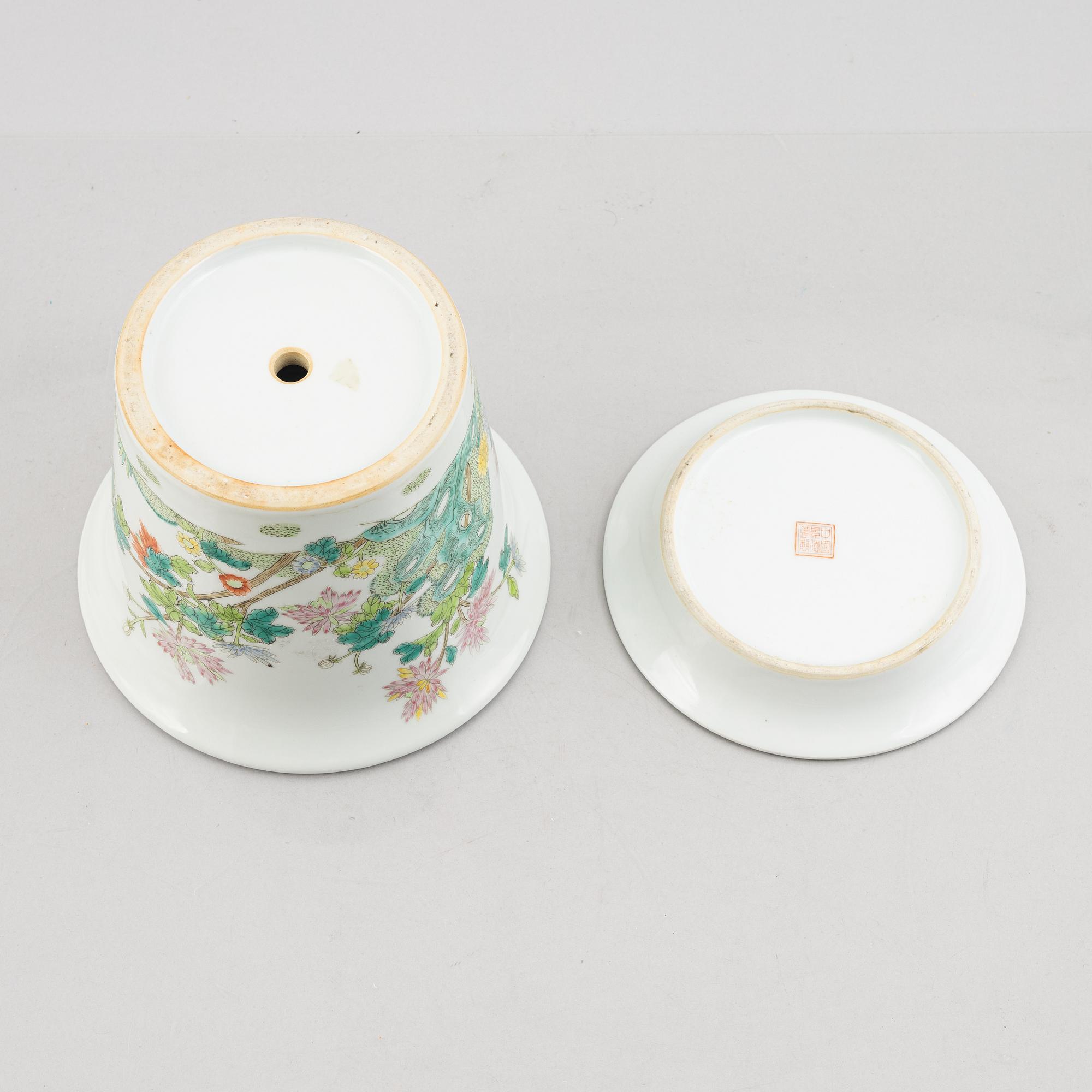 A porcelain plate and a flower pot with stand, China, 19th & 20th century.