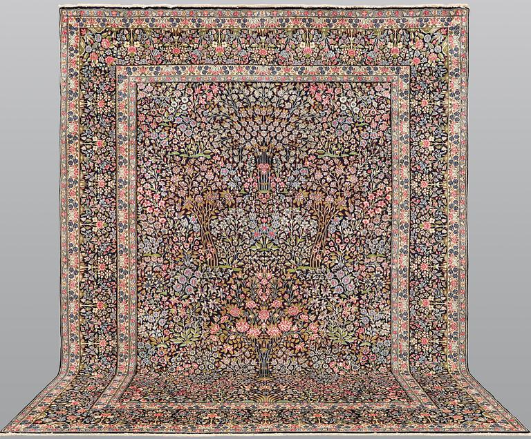 A Kirman Laver carpet, 'Millefleur', approx. 388 x 300 cm.