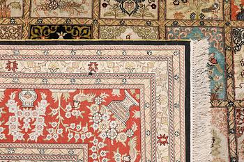 An oriental silk carpet, approx. 376 x 274 cm.