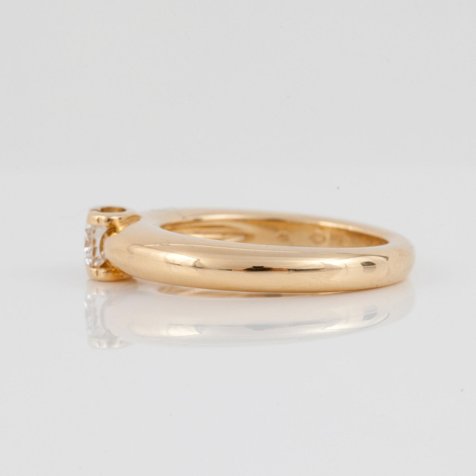 RING, signerad Cartier, Serienummer: 54KQ030, med briljantslipad diamant ca 0.35 ct. Kvalitet ca G-H/VS1.