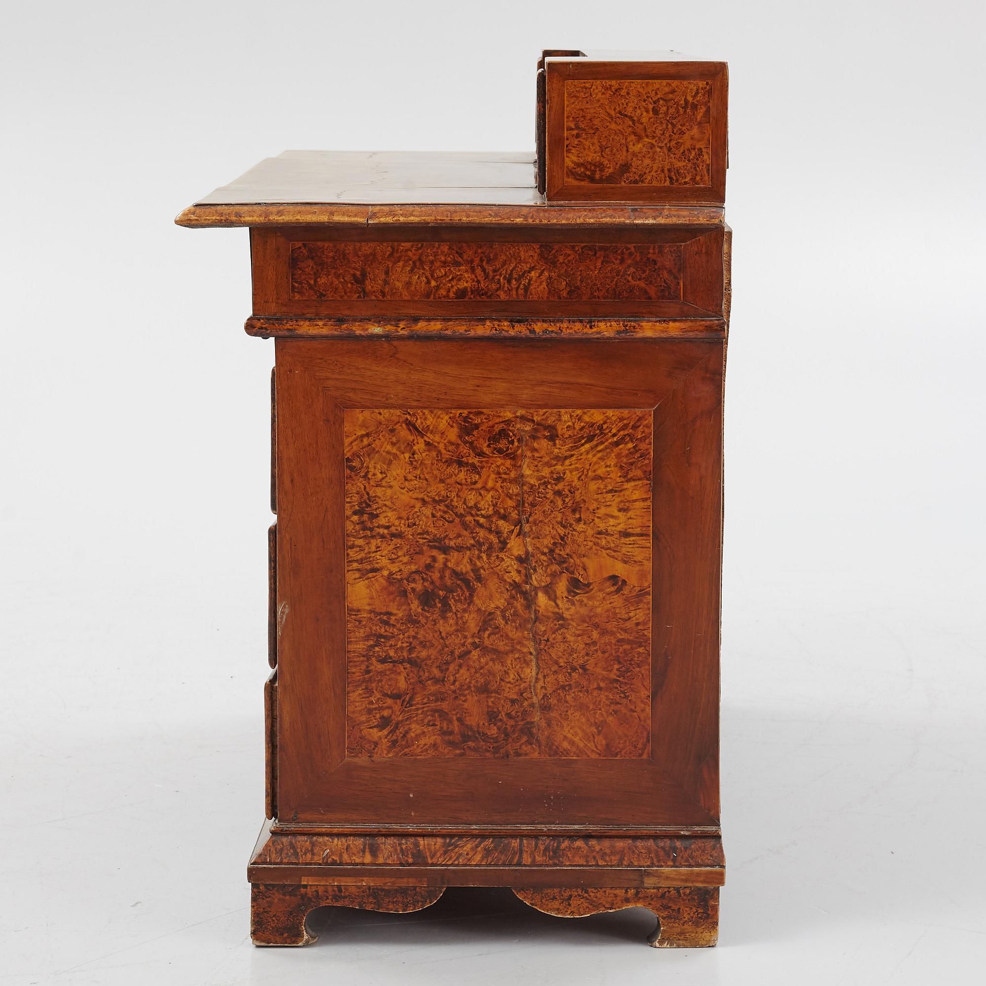 A Swedish late Baroque alder-veneered 'knee-hole' writing desk, first part of the 18th century.