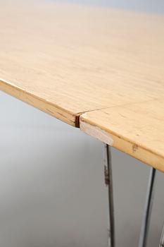 A conference table named "Superellips", designed by Bruno Mathsson and Piet Hein for Fritz Hansen.