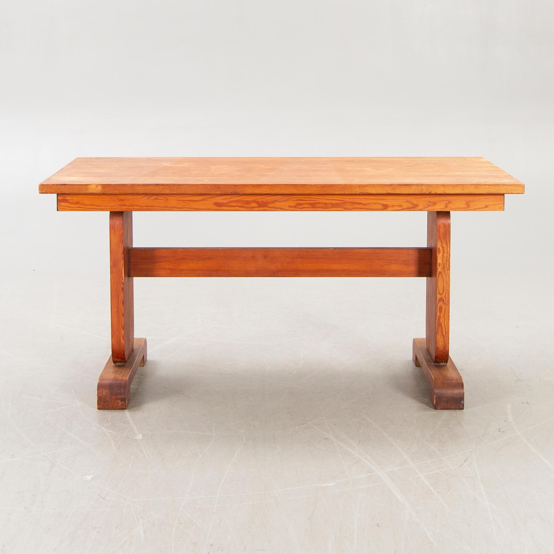 A 1940s pine dining table.