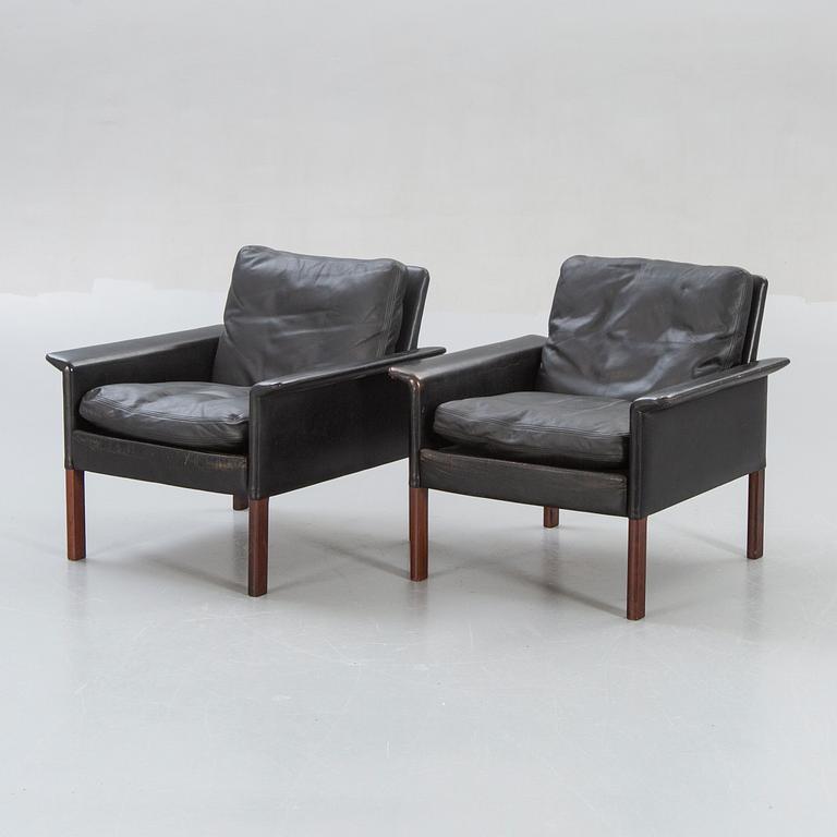A pair of 1960s leather easy chairs.