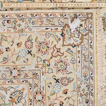 A silk rug from possibly from Kashan, 201 x 139 cm.