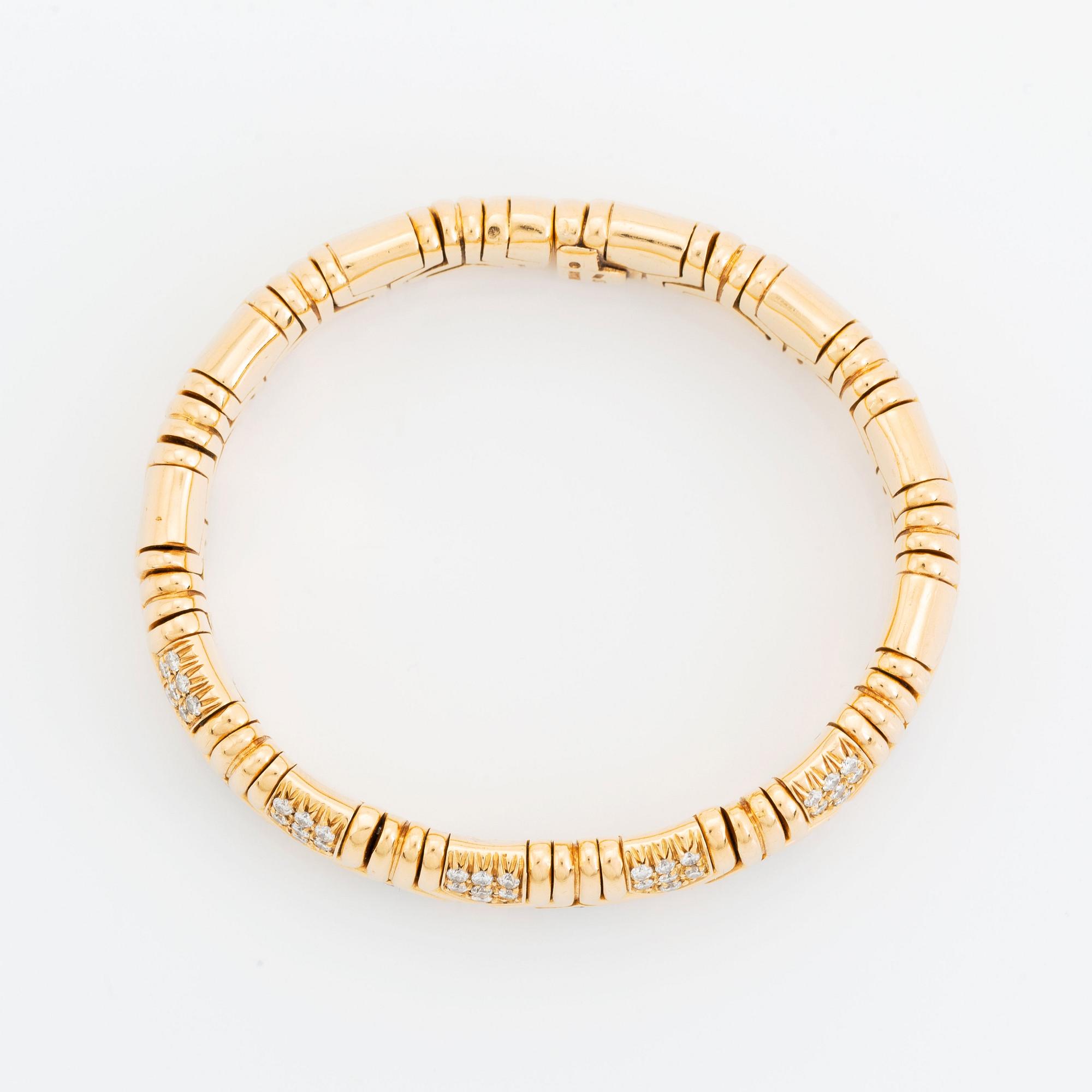 An 18K gold Bulgari bracelet set with round brilliant-cut diamonds.