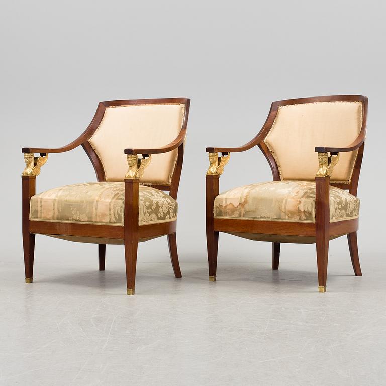 A pair of early 20th century Empire style armchairs.
