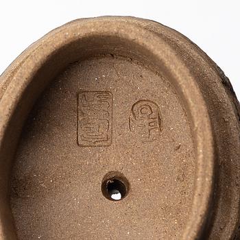 Zhou Dingfang, A naturalistic 'sack form' yixing teapot, China, 1990s.