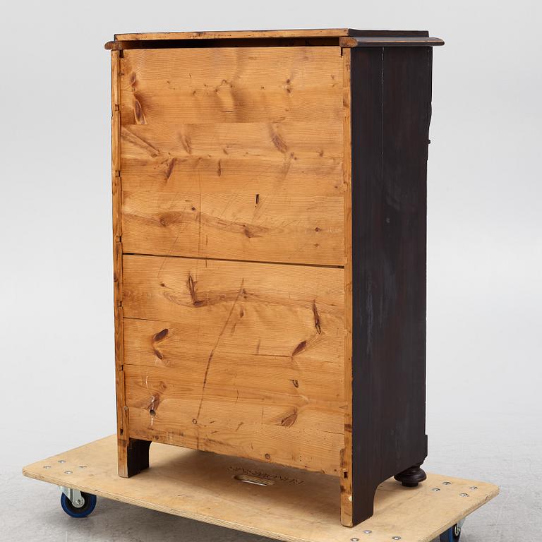 A chest of drawers, circa 1900.