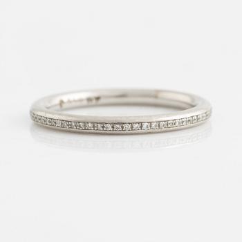 A platinum eternity band set with diamonds.
