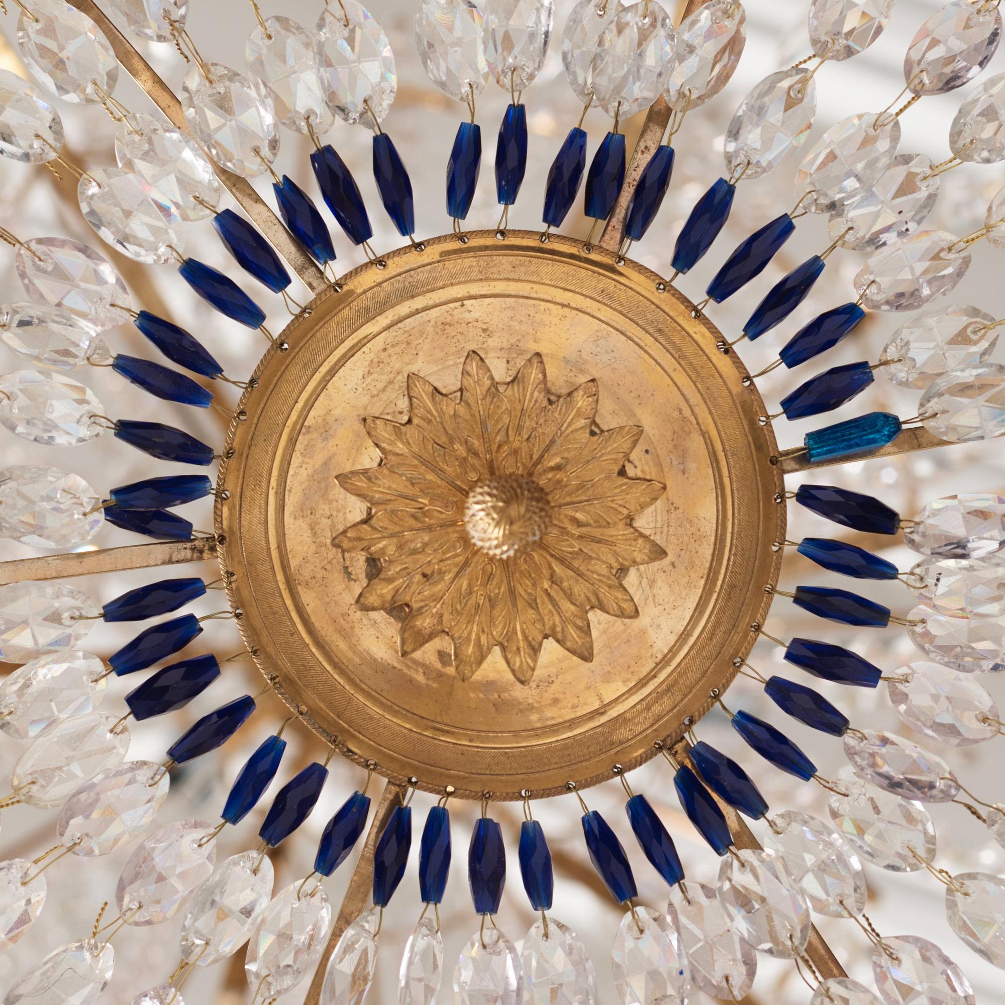A late Gustavian gilt brass and cut glass thirteen-light chandelier, circa 1800.