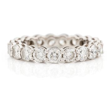 A platinum Tiffany & Co eternity ring set with round brilliant-cut diamonds.