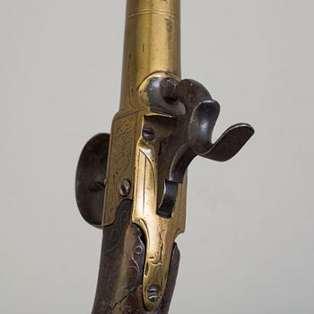 A secon half of the 19th century pair of Queen Anne brass percussion pistols converted from flintlock by Brueton, London.