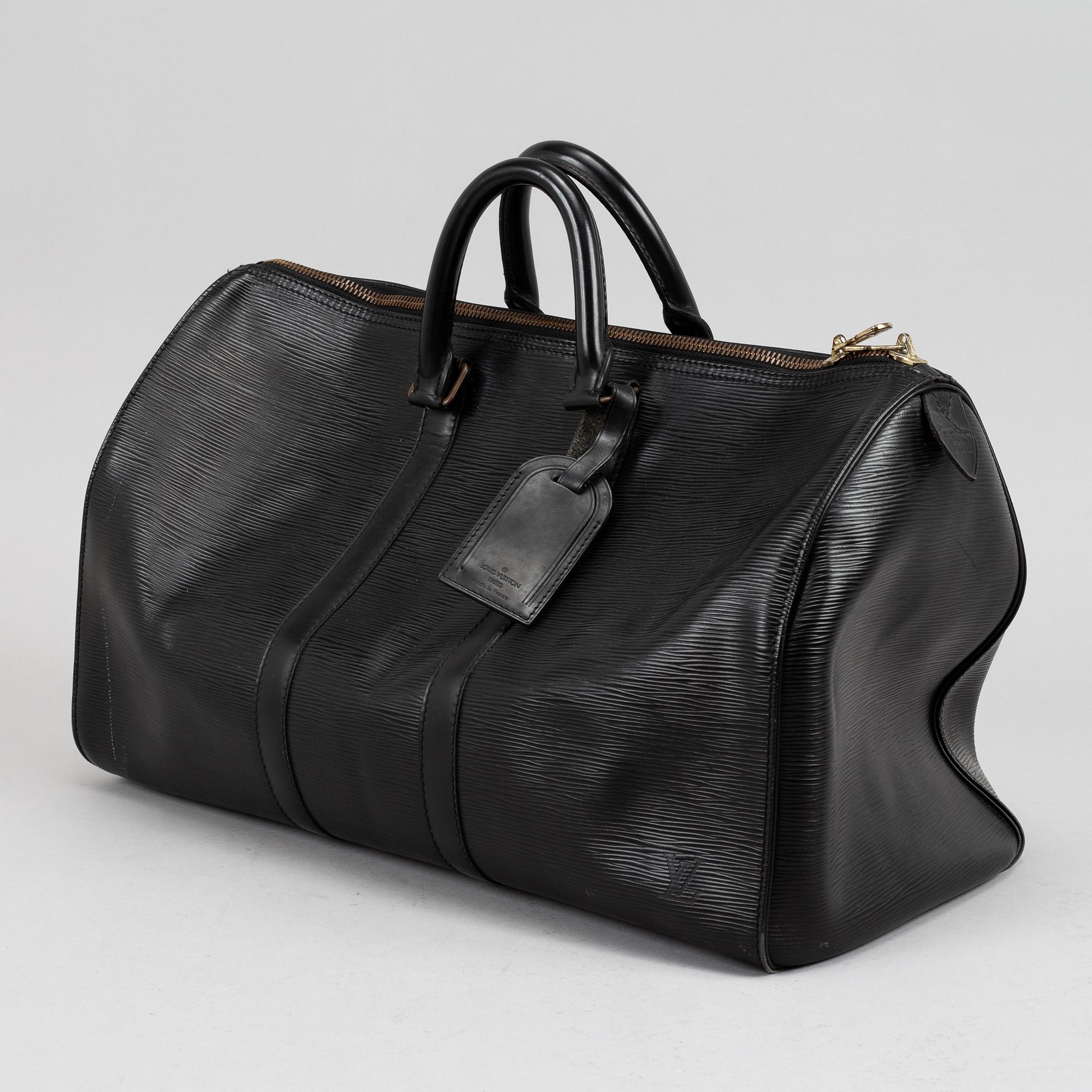 Louis Vuitton, a black Epi 'Keepall 50' weekend bag.